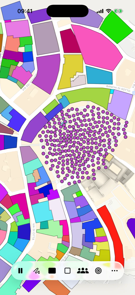 Walky on an iPhone showing Apple Park: the ring campus in Cupertino, with the surrounding buildings imported from OpenStreetMap as coloured walls and a crowd of green pedestrians spread across the courtyard.